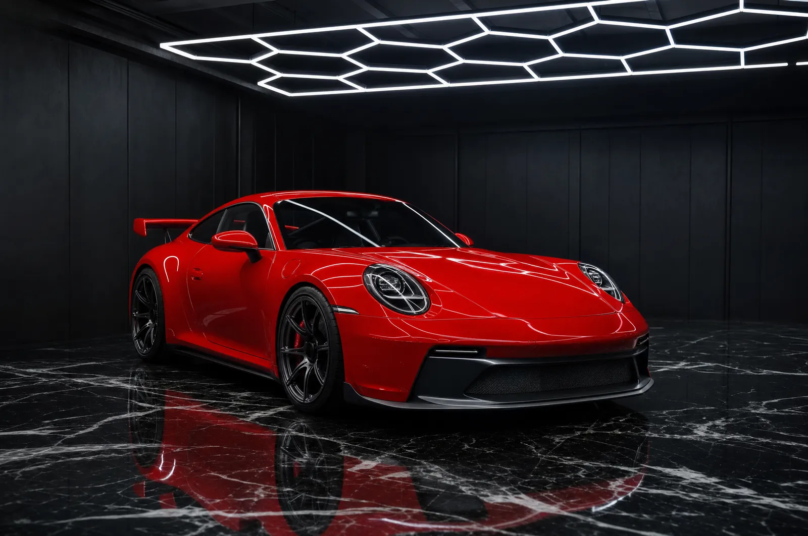 A red Porsche 911 GT3 in gloss factory paint